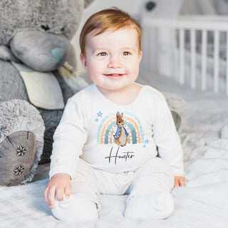 Adorable Baby Peter Rabbit Sleepsuit featuring the beloved character. Crafted for comfort and cuteness, perfect for sweet and enchanting dreams. Available in various sizes for a cozy and magical night time experience.