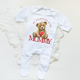 Adorable Personalised Valentine's Day Baby Sleepsuit featuring charming love-themed motifs. Crafted with softness and care for your little cupid. Personalise with your baby's name for a special touch. Available in various sizes for a memorable first Valentine's Day.