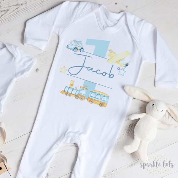 Charming 1st Birthday Sleepsuit from Sparkle Tots – featuring a whimsical train design, perfect for a cosy and adorable celebration for your little boy.