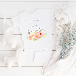 Charming Personalised Auntie Baby Shirt/Vest, customised with the auntie's name. Crafted for comfort and cuteness, perfect for celebrating the special bond. Available in various sizes for your little bundle of joy.