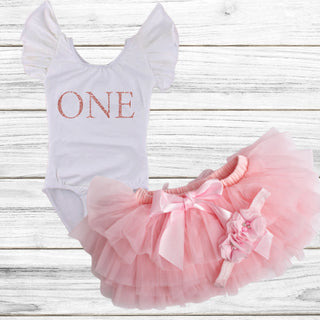 Adorable 1st Birthday Outfit in Baby Pink from Sparkle Tots – a stylish tutu set with a bow for your little one's special celebration.