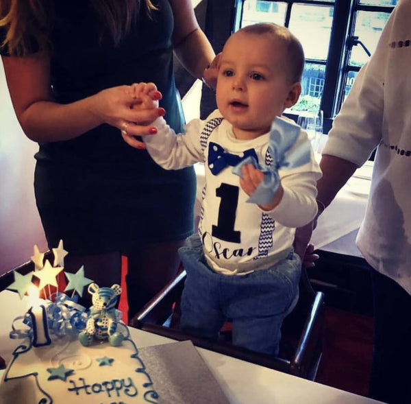 Adorable Baby Boy's 1st Birthday Blue Bodysuit, perfect for the special celebration. Crafted for cuteness and comfort, available in various sizes for a snug fit. Let the birthday fun begin in style!